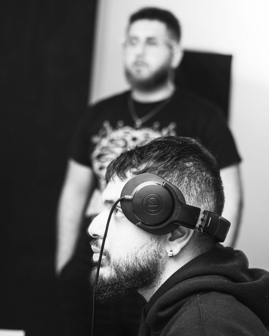 Engineer in headphones listening closely during a session at Harmless Studio